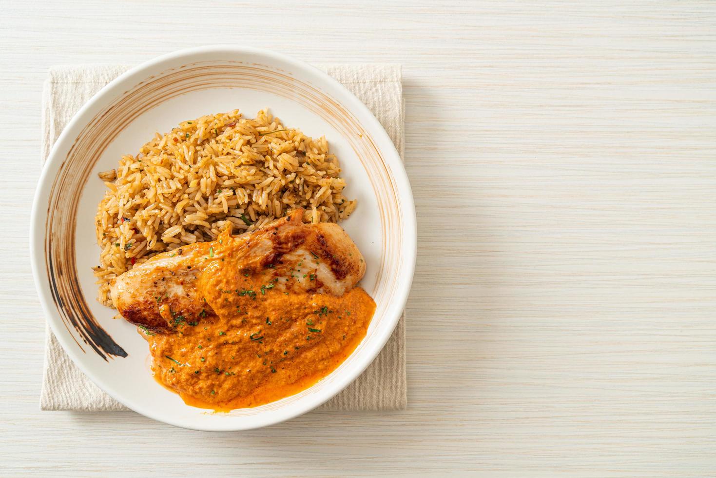 grilled chicken steak with red curry sauce and rice photo