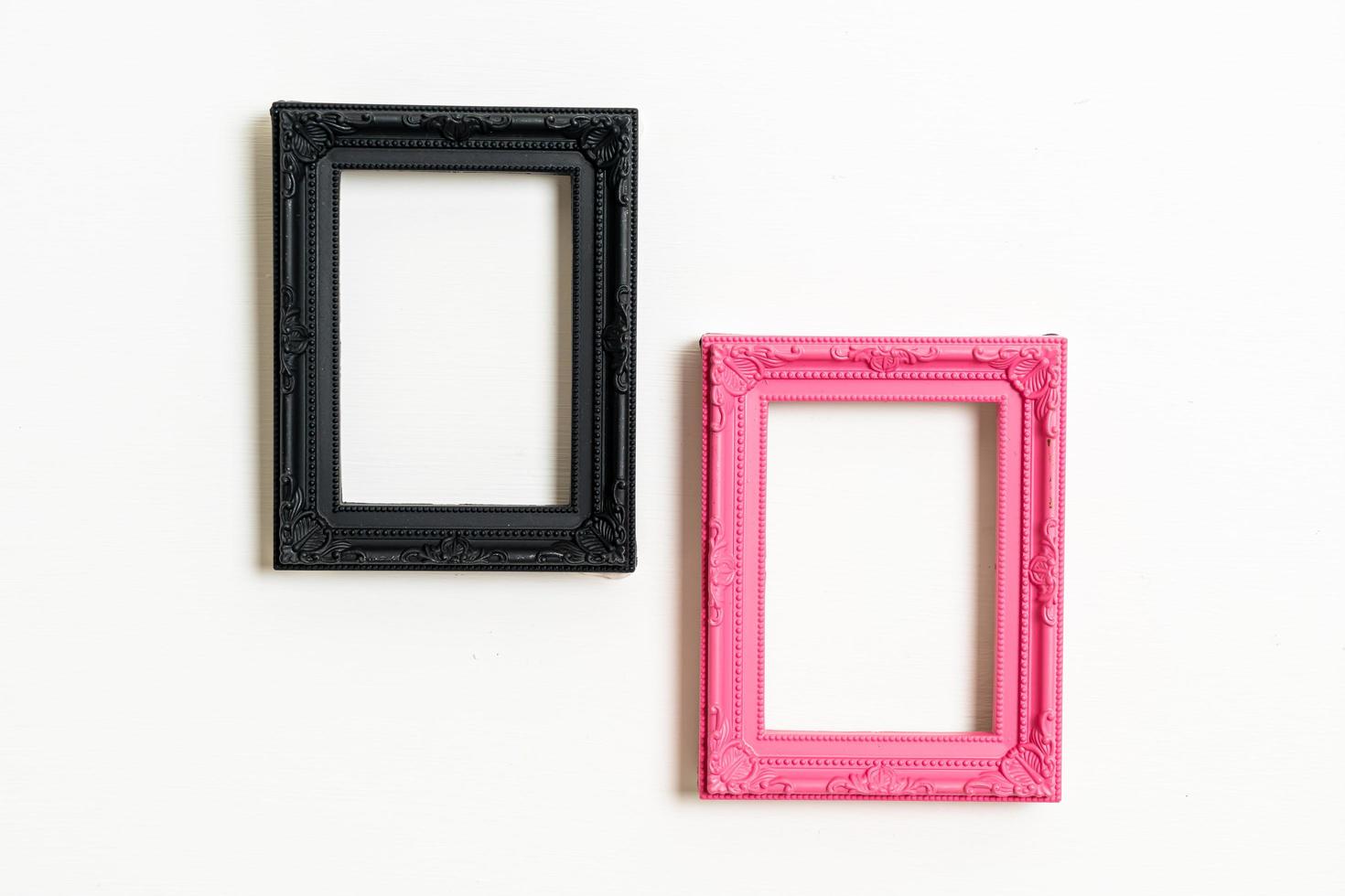 empty picture frame on white wall background photo