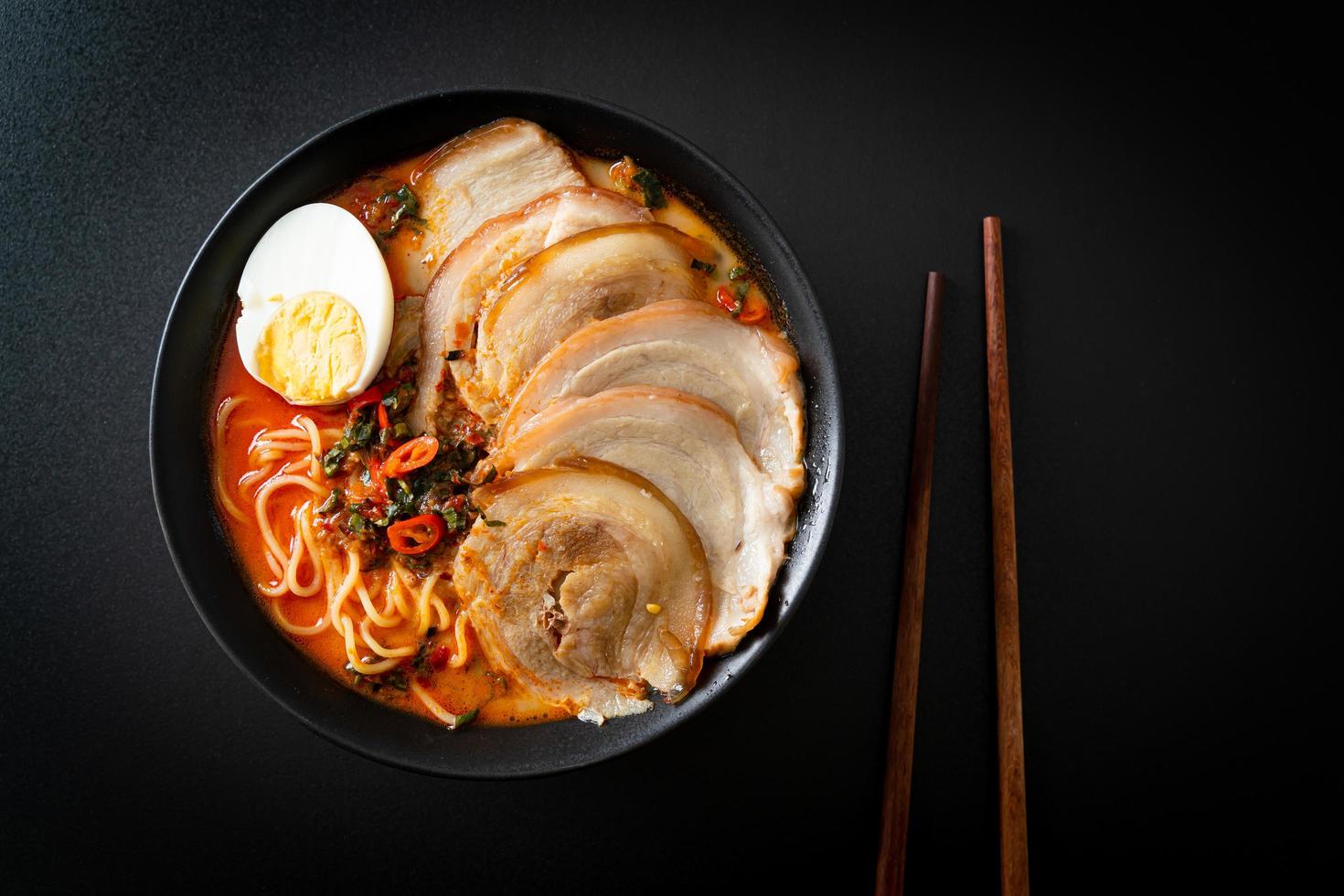 Ramen Noodles Spicy Tomyum Soup with Roast Pork photo