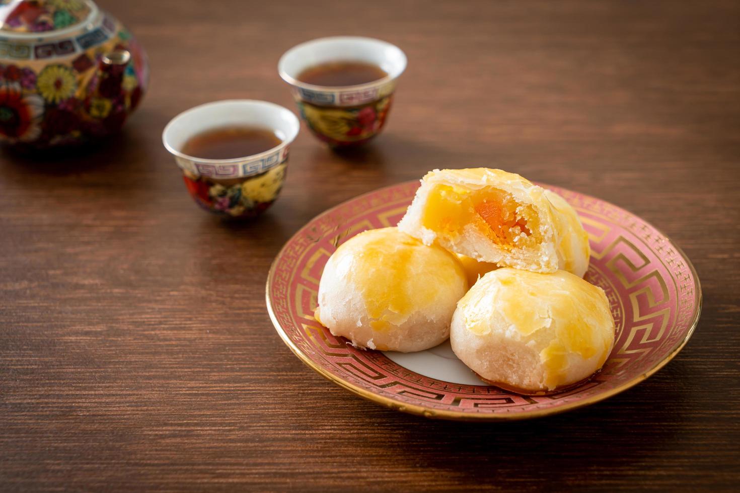 Chinese pastry moon cake with salted egg peanut or Spring Roll pastry with nuts and salted eggs photo