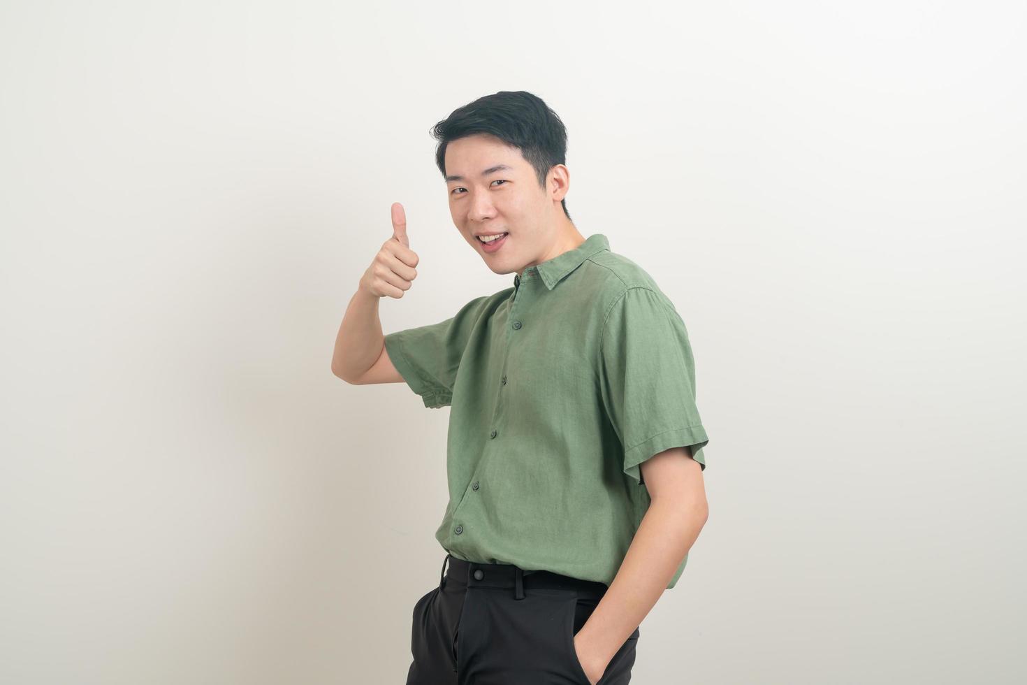 young Asian man thumbs up or ok hand sign photo