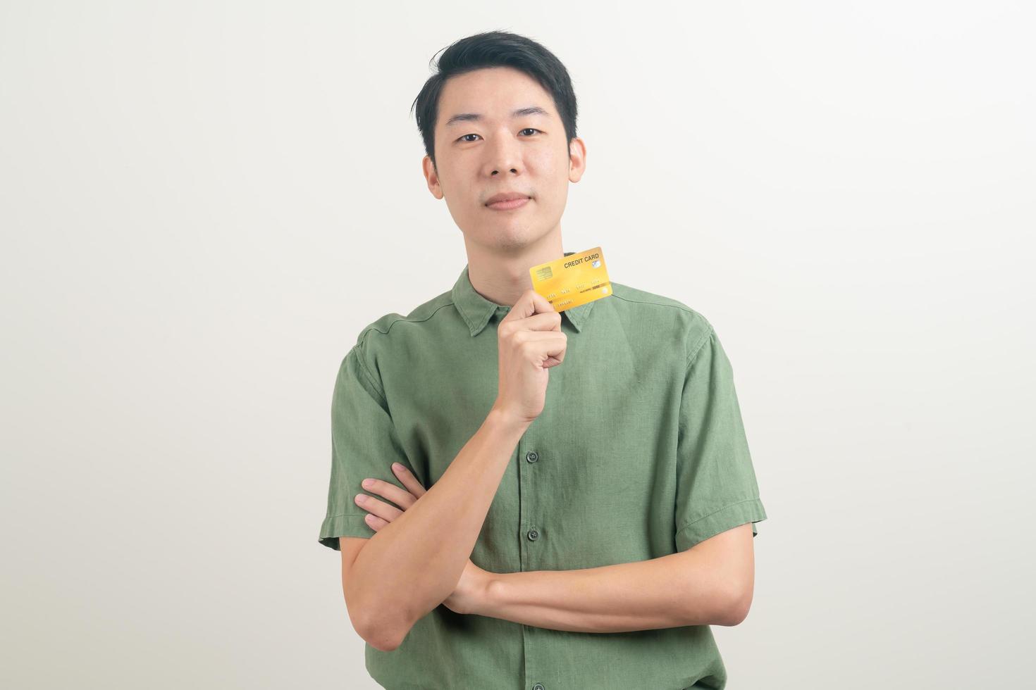 young Asian man holding credit card photo