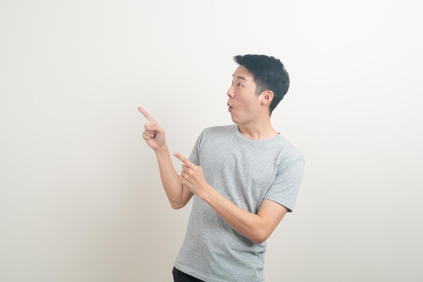 Asian man with hand pointing or presenting on white background photo