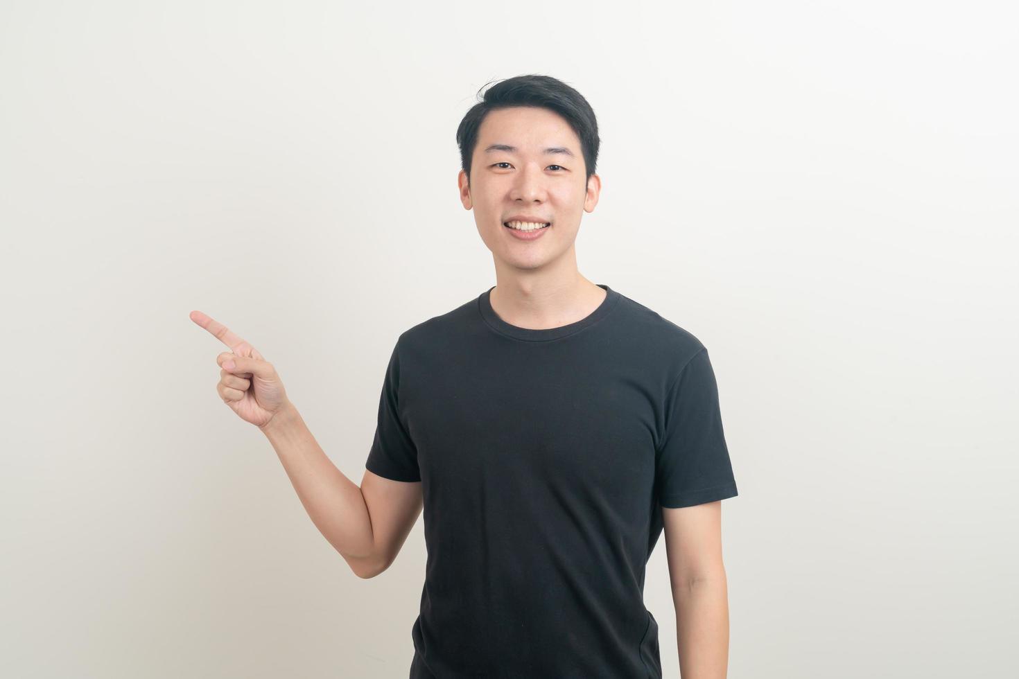 Asian man with hand pointing or presenting on white background photo