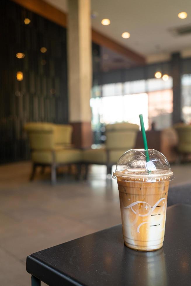 caramel macchiato coffee cup in coffee shop photo