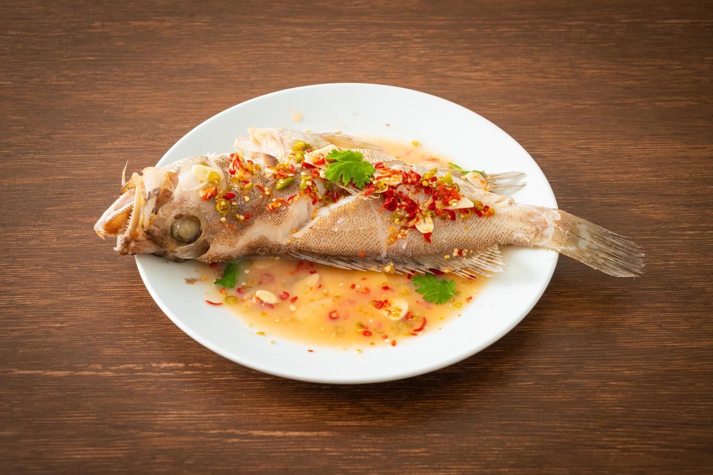 Steamed grouper fish with lime and chillies photo