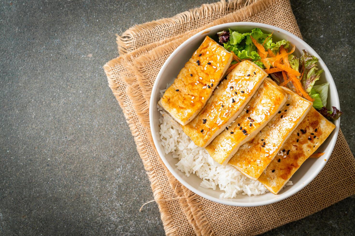 teriyaki tofu rice bowl - vegan food style photo
