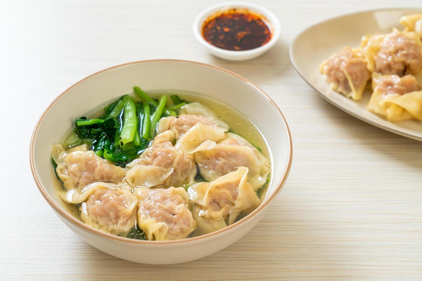 pork wonton soup or pork dumplings soup with vegetable photo