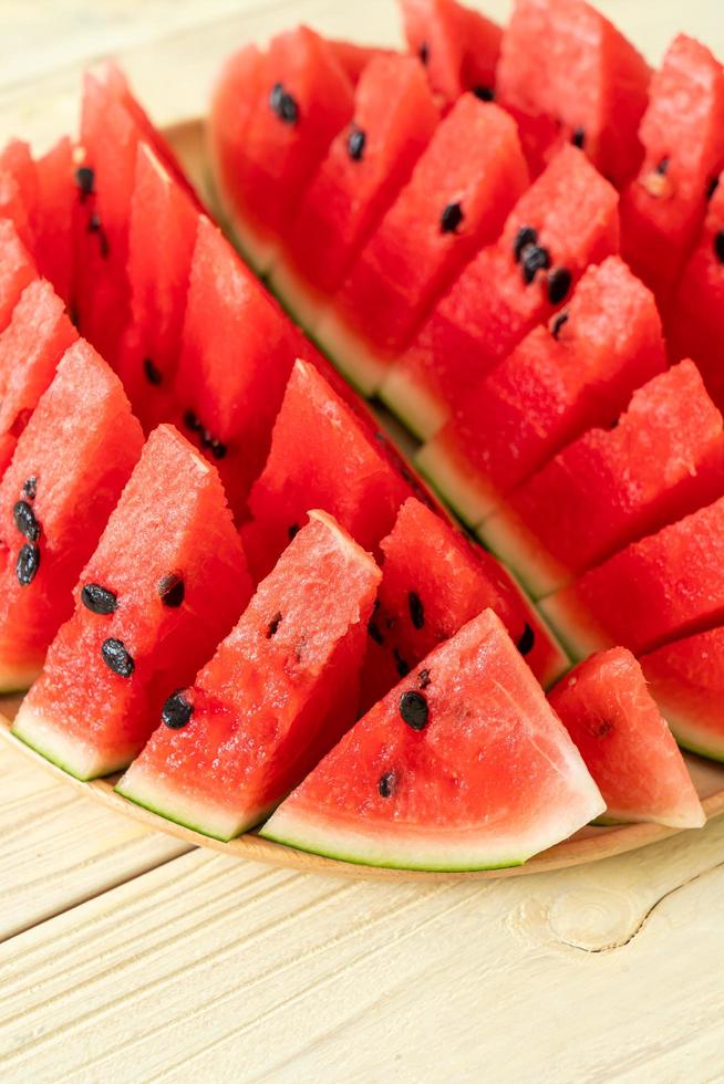 fresh watermelon sliced on plate photo