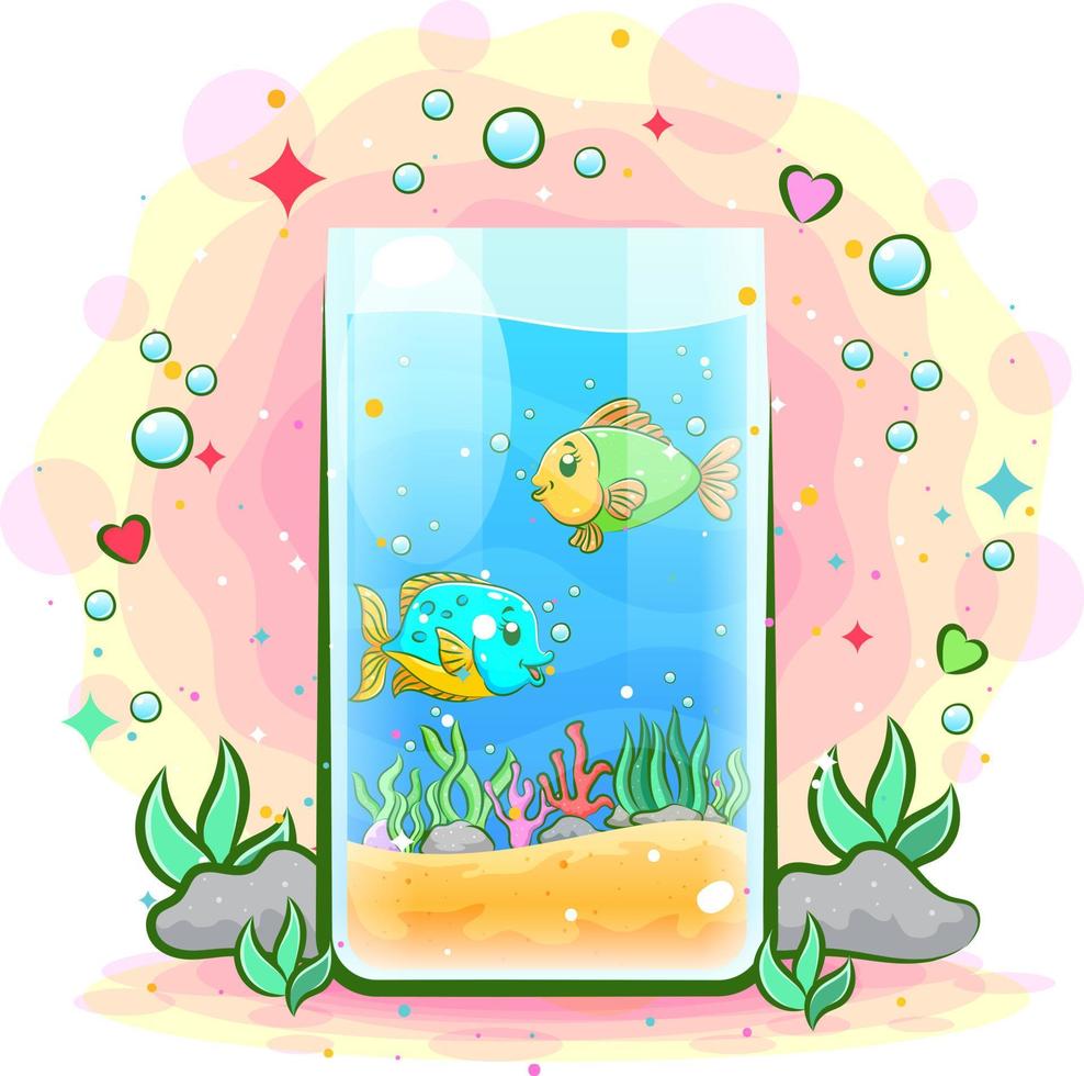 A tube of aquarium has two fish and many sand vector