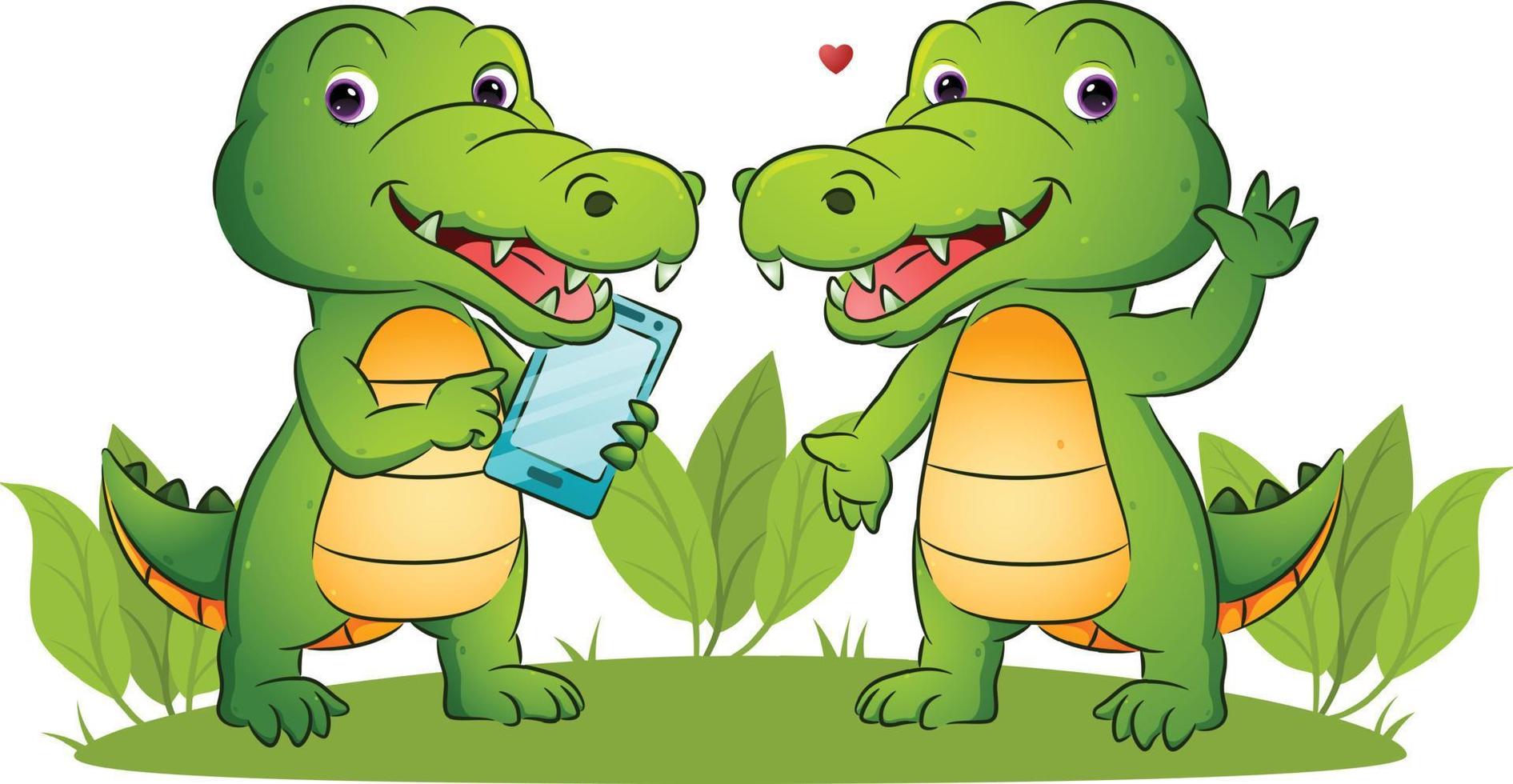 The couple of happy crocodile is holding a smart phone vector