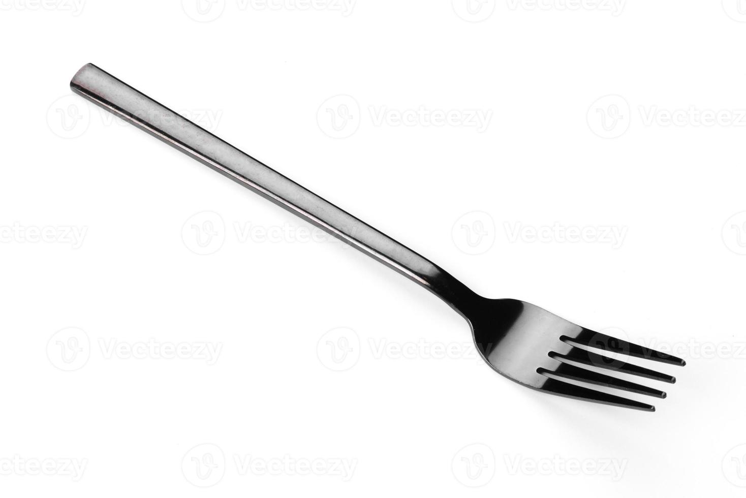 Beautiful dining fork isolated on a white background photo