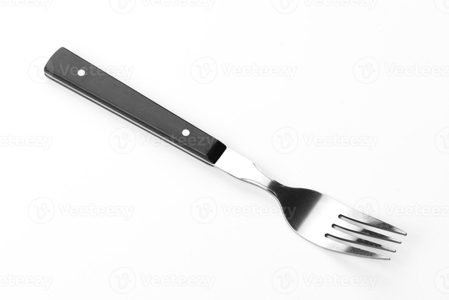 Hermoso tenedor de comedor aislado sobre un fondo blanco. foto