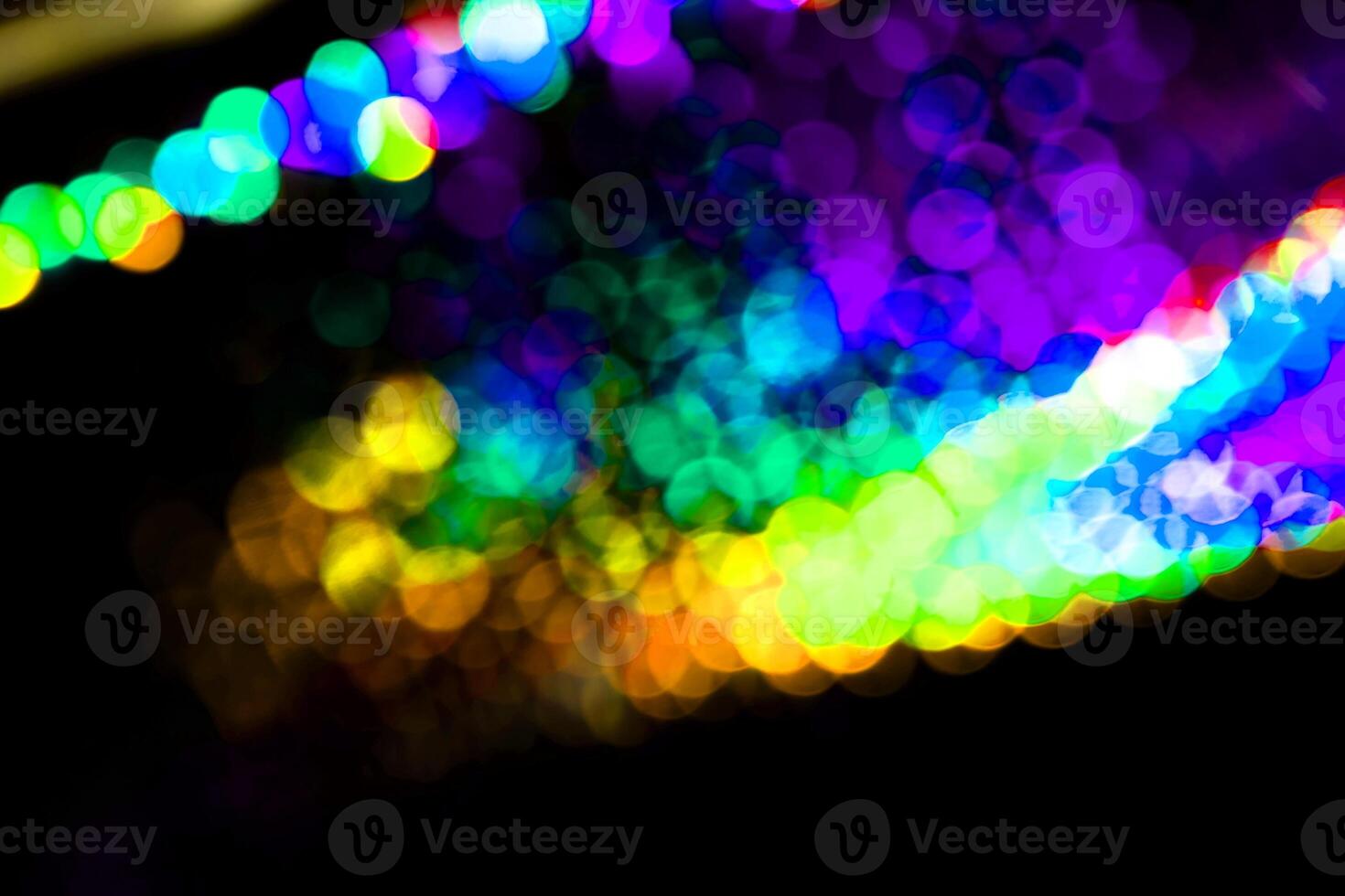 light blue neon abstract texture dark circle colorful light pattern on black. photo