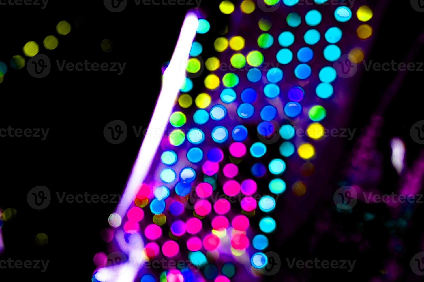 neon abstract texture dark circle colorful light pattern on black. photo