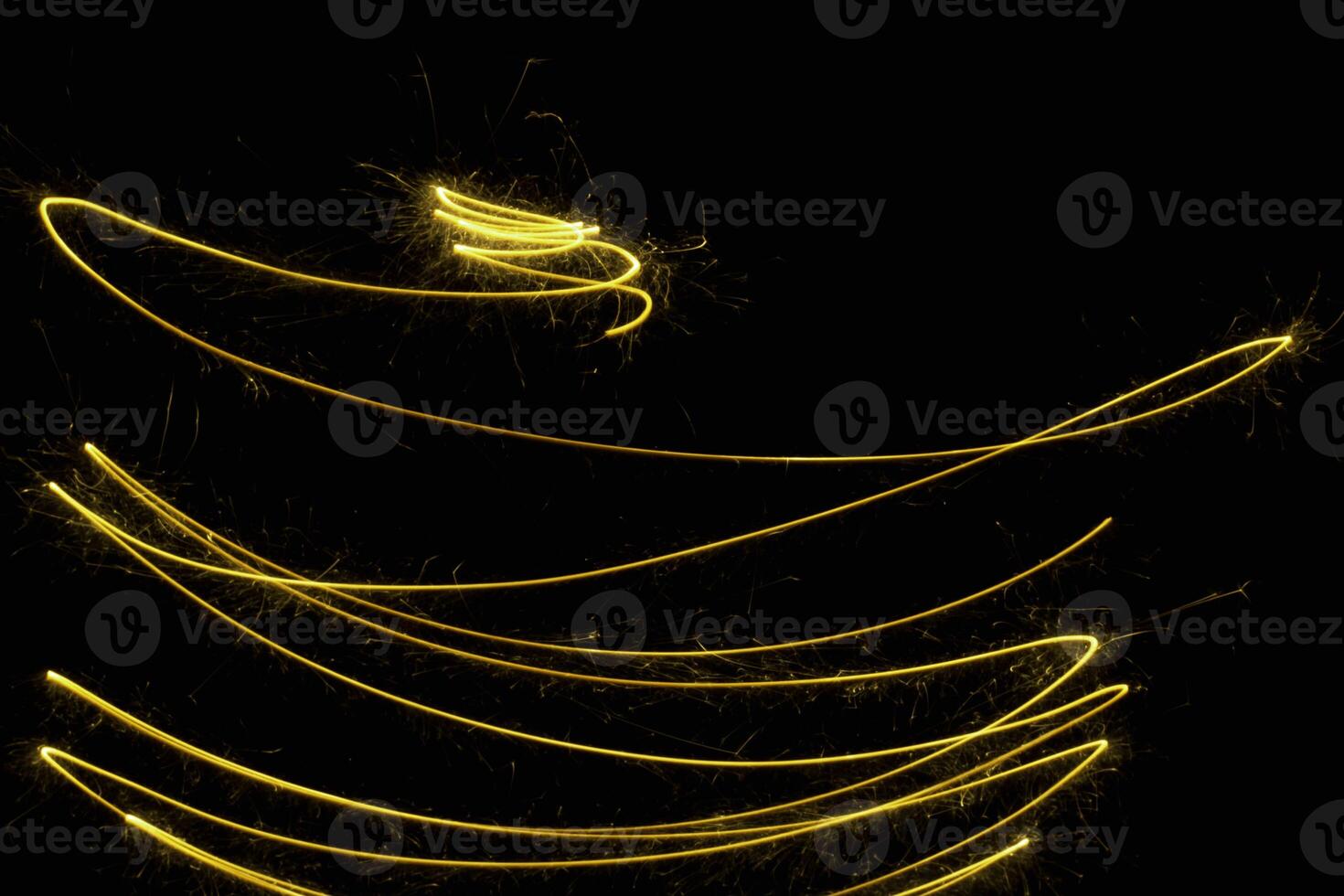 abstract circle gold light trail glowing spiral stylish light effect on a black. photo