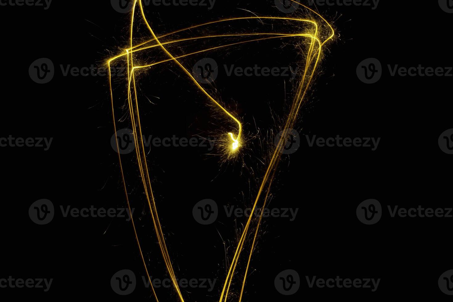 abstract circle gold light trail glowing spiral stylish light effect on a black. photo