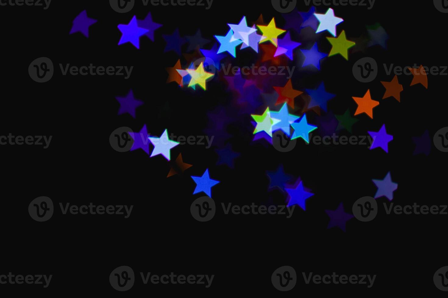 light colorful blue star light effect isolated overlay glitter texture on black. photo