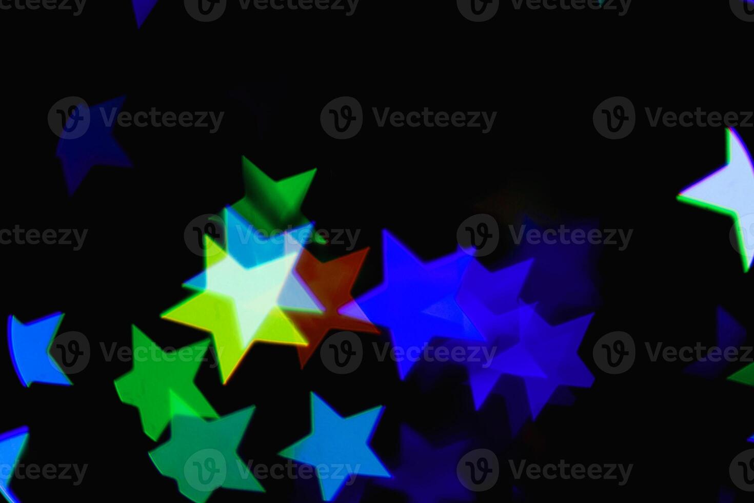 light colorful blue star light effect isolated overlay glitter texture on black. photo