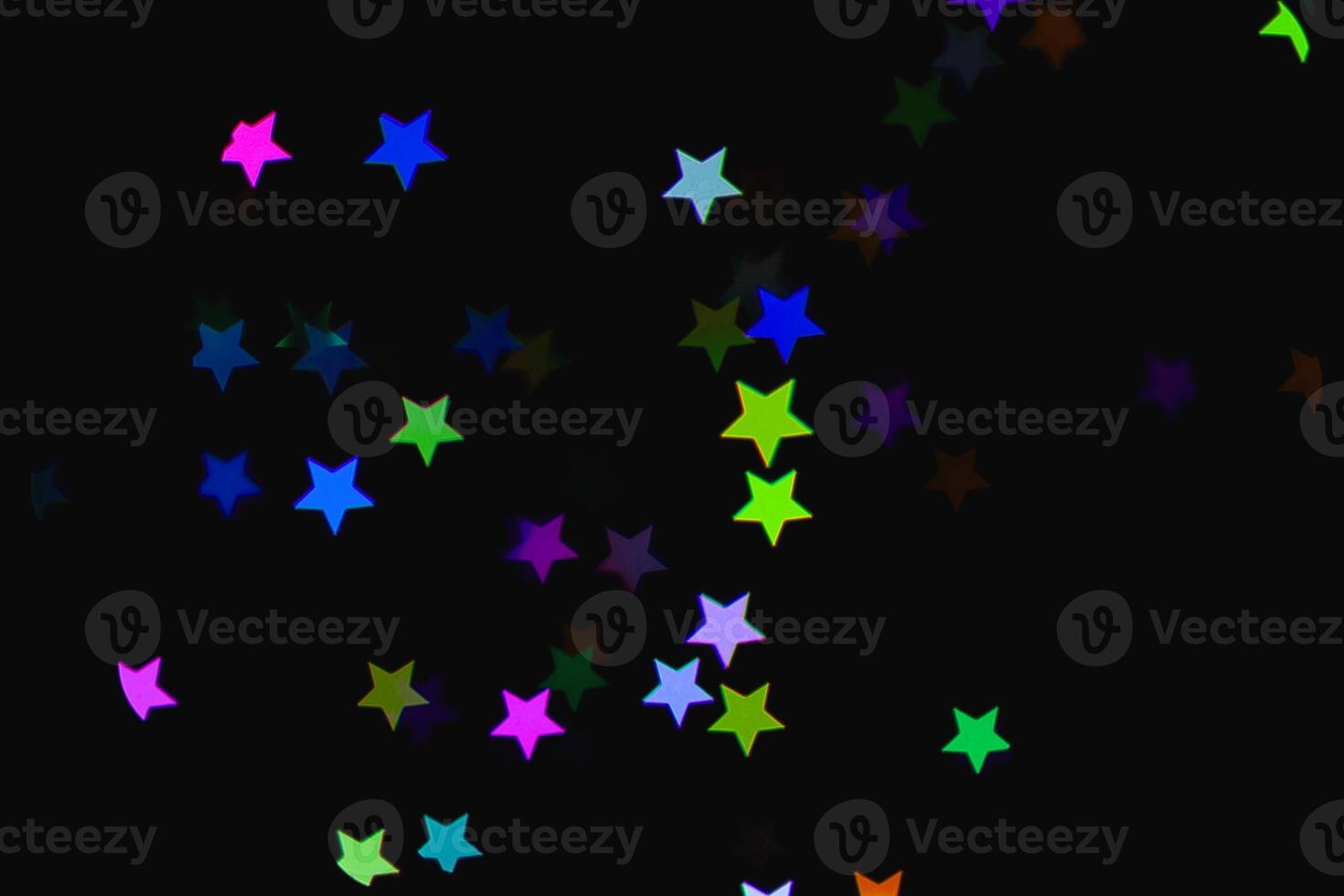 light colorful blue star light effect isolated overlay glitter texture on black. photo