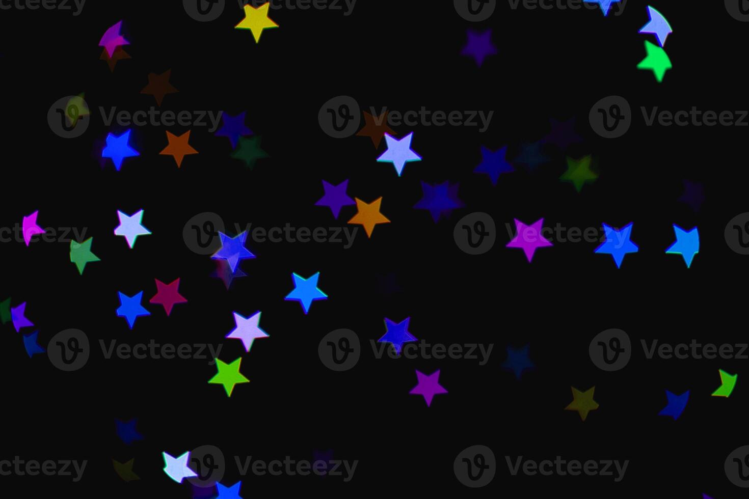 light colorful blue star light effect isolated overlay glitter texture on black. photo