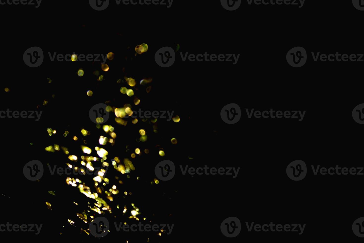 light yellow abstract pattern glitter stardust sparkling lights grunge on black. photo