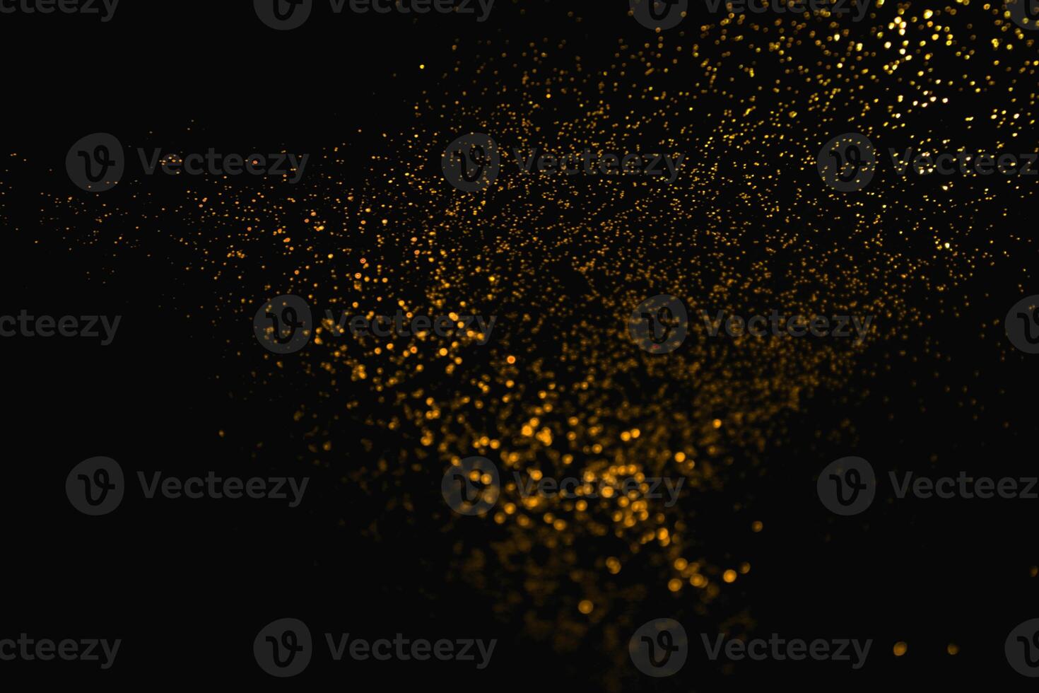 gold abstract pattern glitter stardust sparkling lights grunge on black. photo