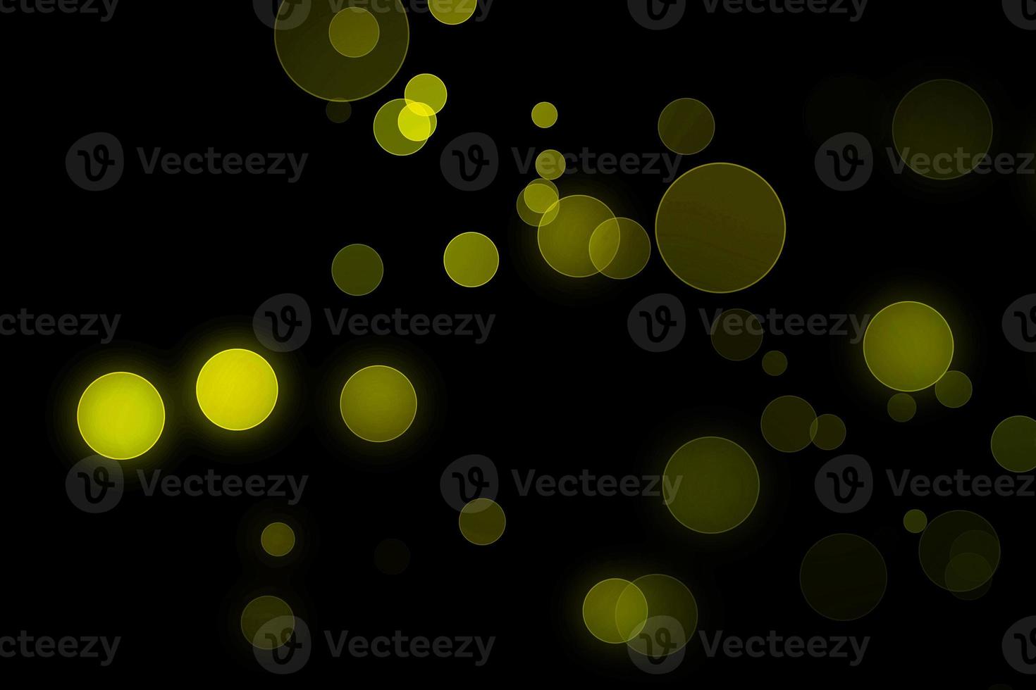 light green blur effect black background.abstract black unfocused blur light dots black . photo