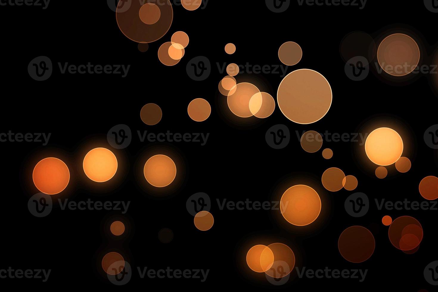 orange blur effect black background.abstract black unfocused blur light dots black . photo