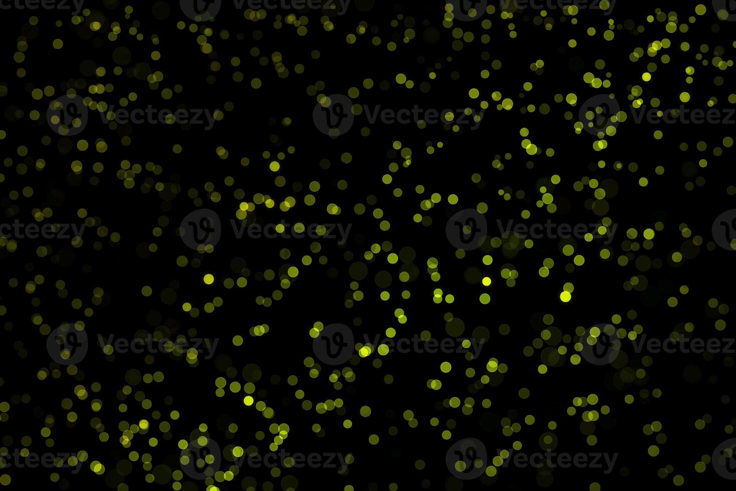 light green blur effect black background.abstract black unfocused blur light dots black . photo