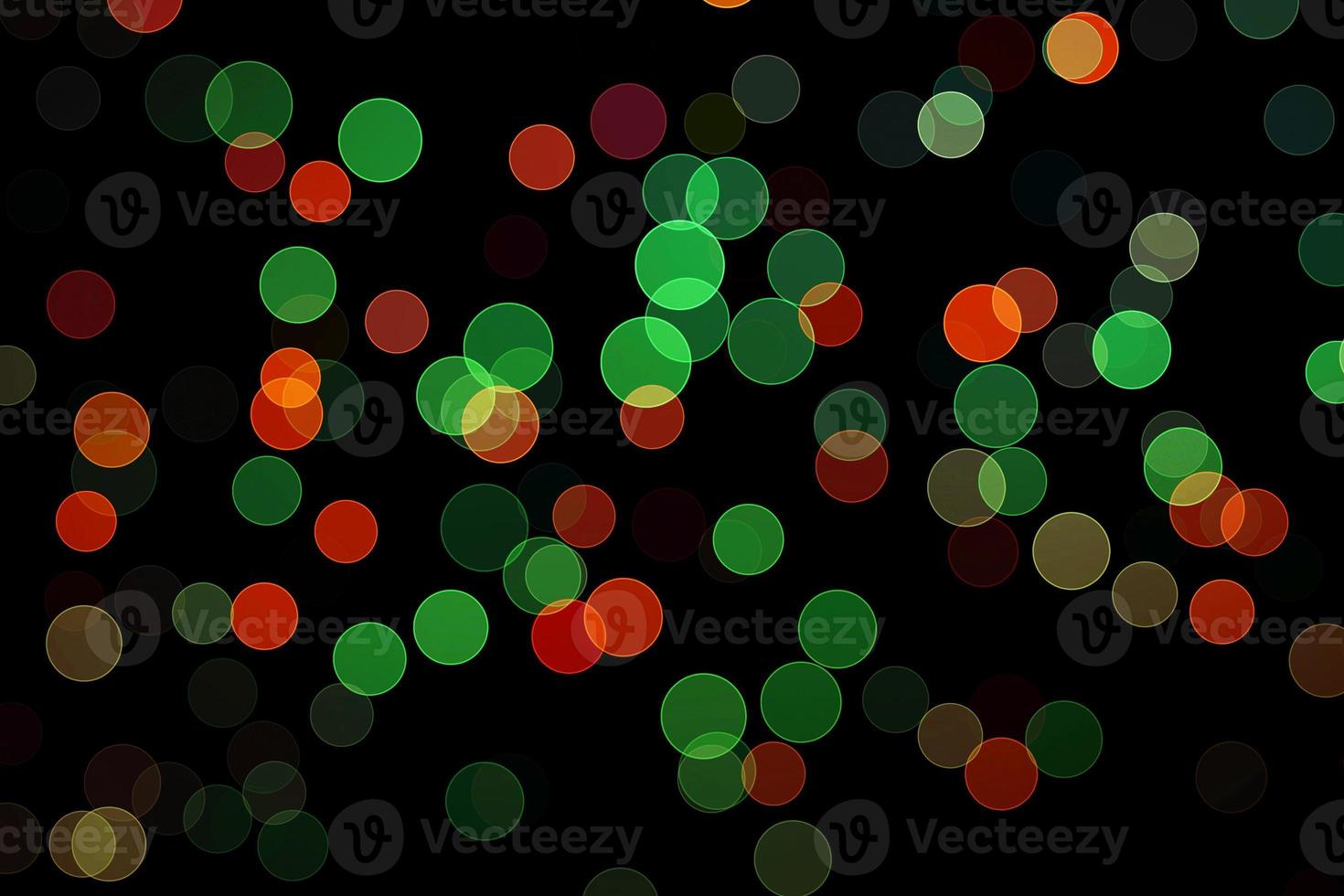 green and red blur effect black background.abstract black unfocused blur light dots black . photo