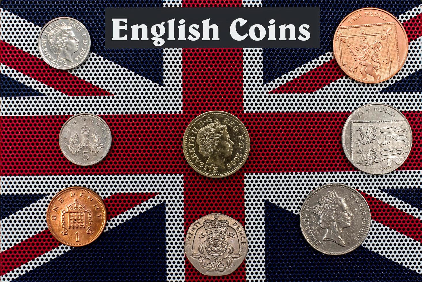 English coins on a British flag background. Concept of collecting British coins. photo