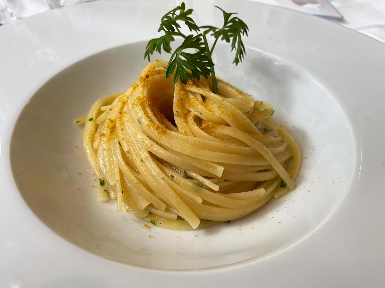 Dish of Linguine Pasta with mullet. Italian restaurant cuisine. photo