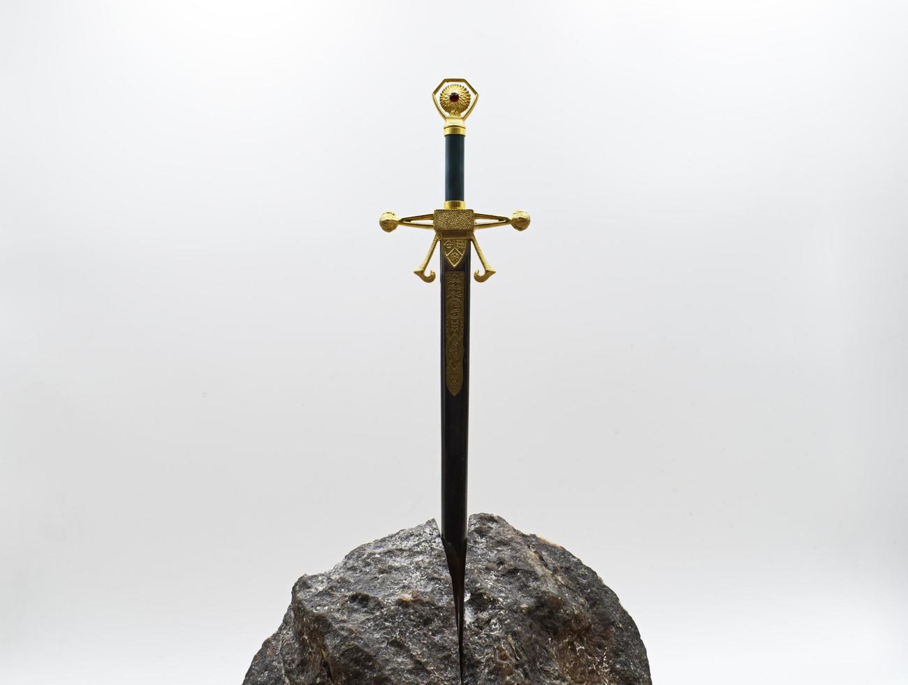 Excalibur, the mythical sword in the stone of King Arthur photo