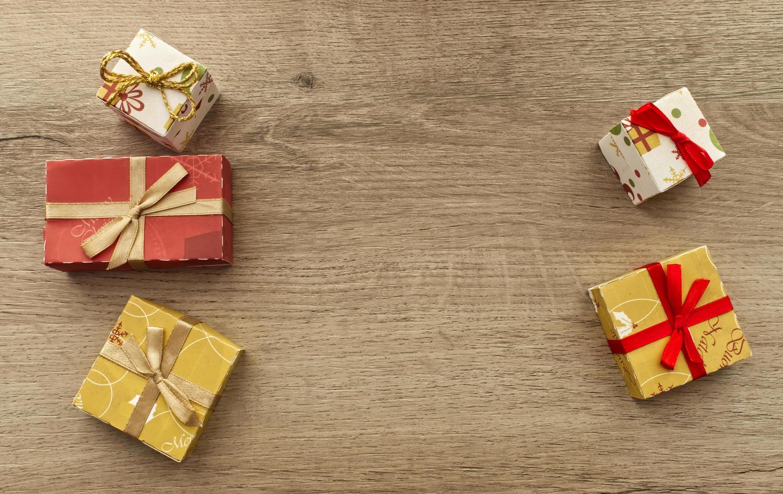 Christmas gifts box on wooden background. Top view with copy space for your text photo