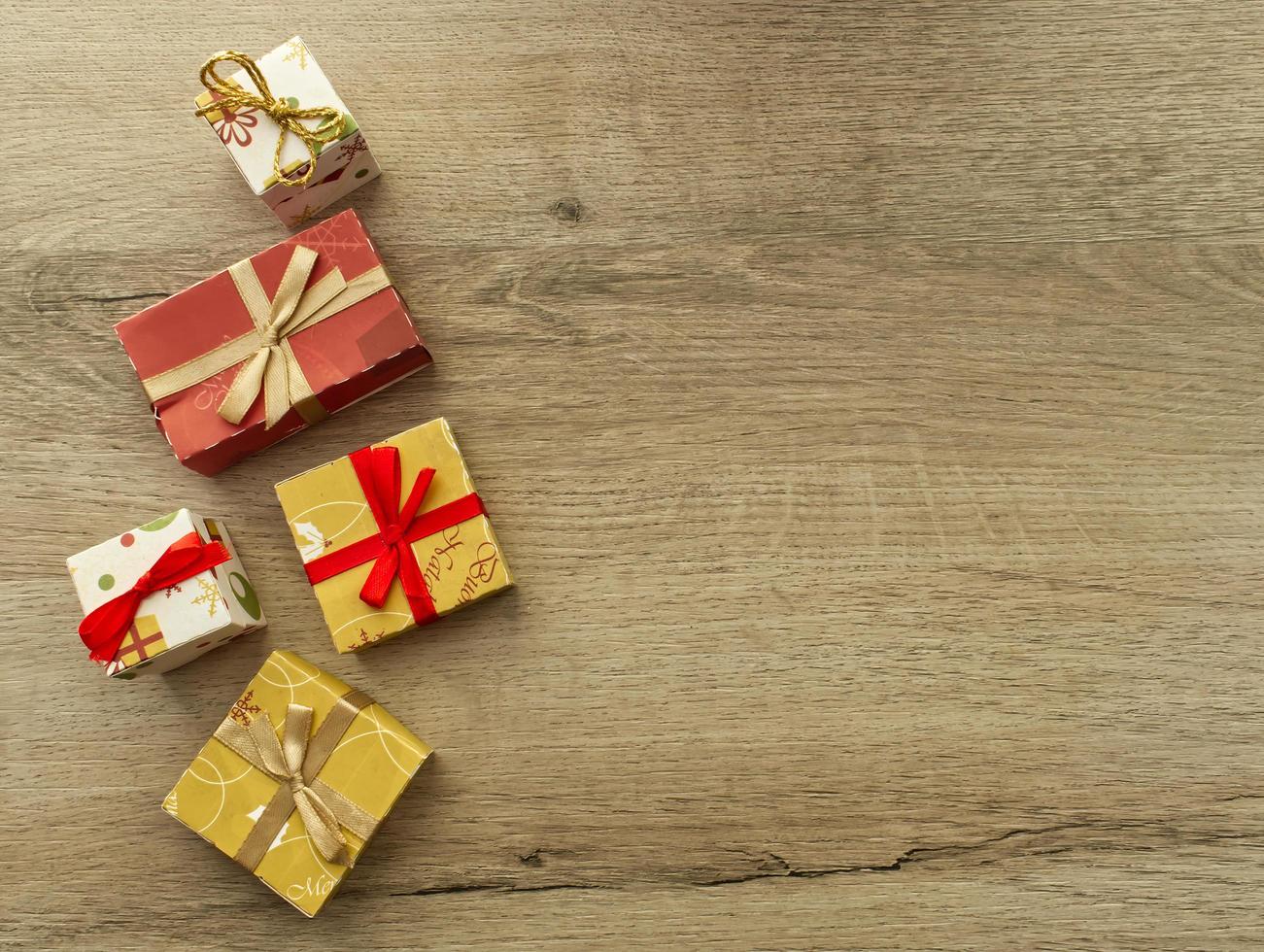 Christmas gifts box on wooden background. Top view with copy space for your text photo