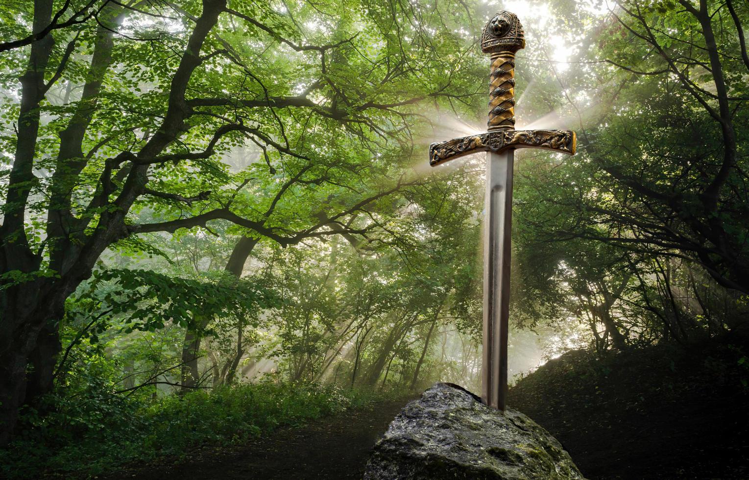 Excalibur, the mythical sword in the stone of King Arthur photo