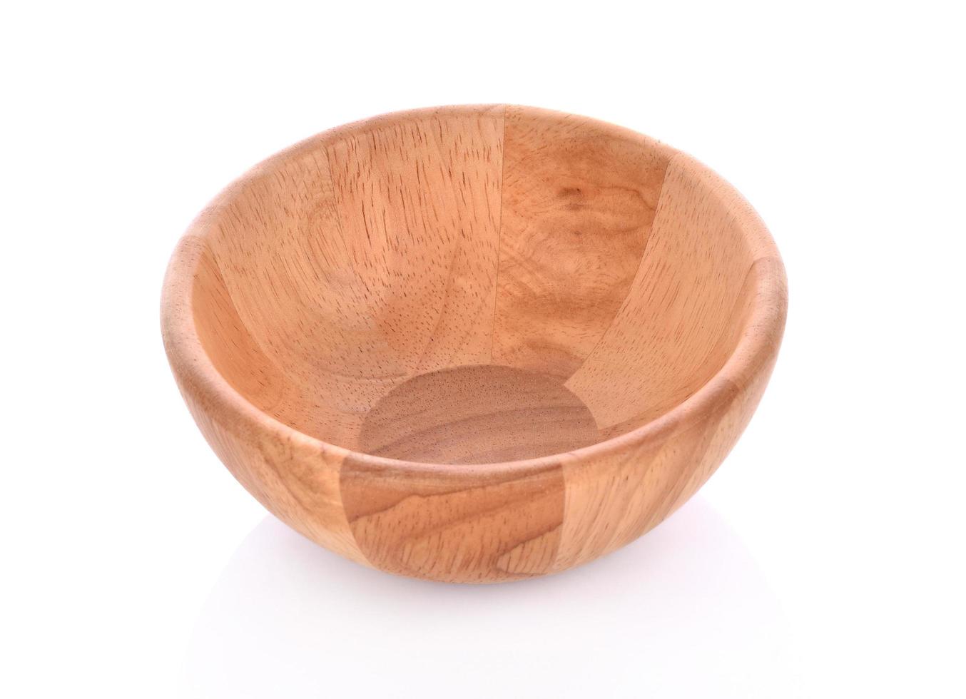 Round wooden bowl on white background photo