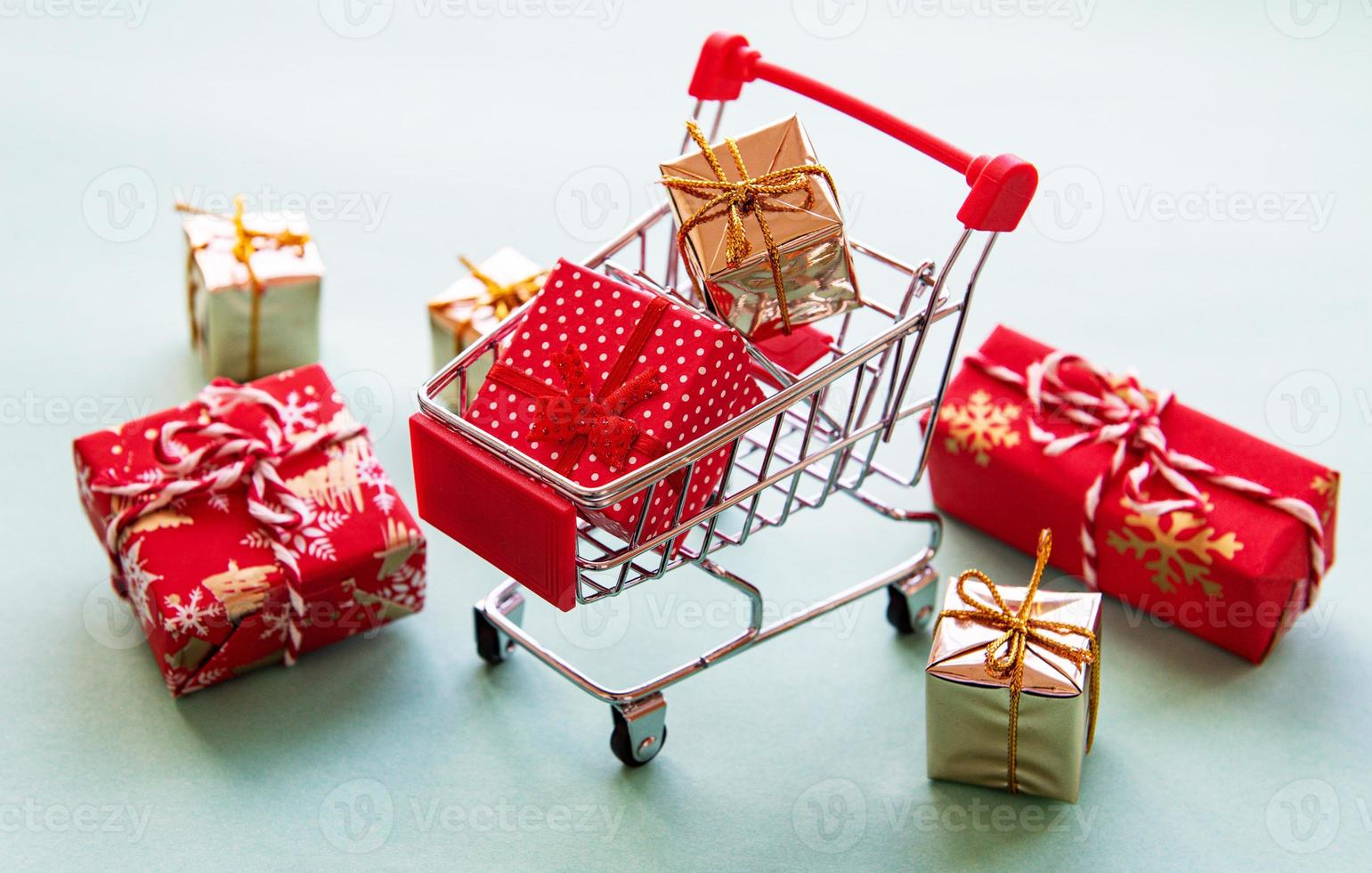 Shopping cart with gift boxes photo