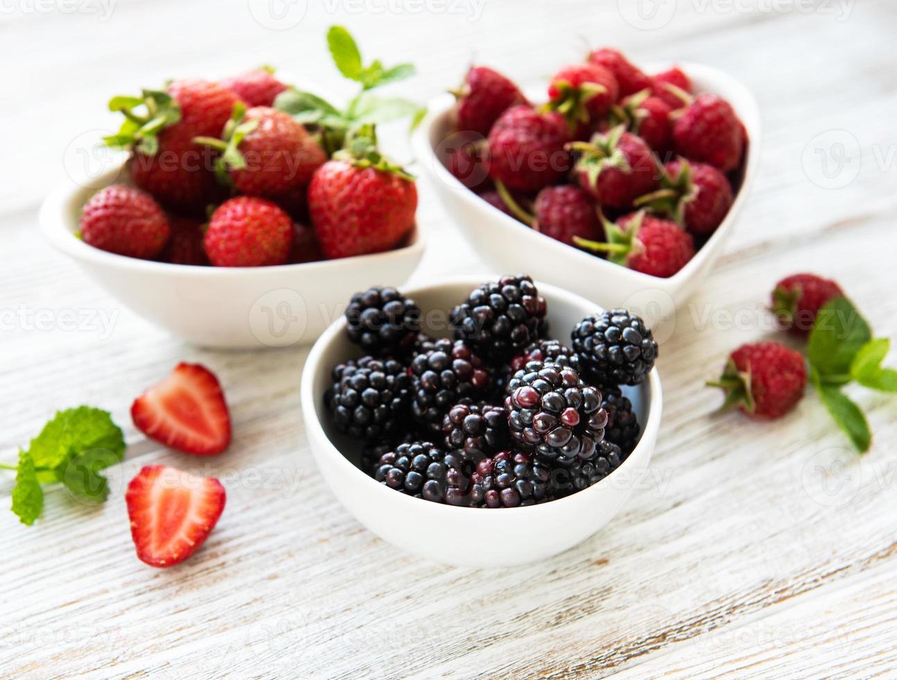 Bowls with summer berries photo