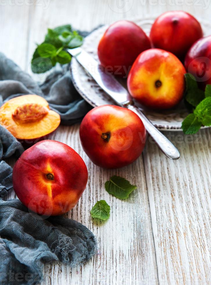 Plate with fresh nectarines photo