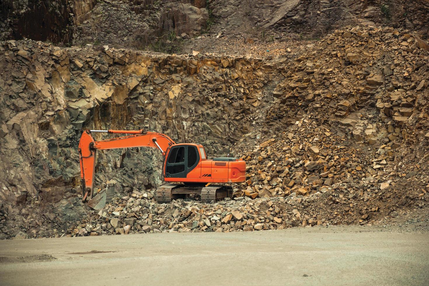 Excavator with stones and rocks in a quarry near Bento Goncalves. A friendly country town in southern Brazil famous for its wine production. photo