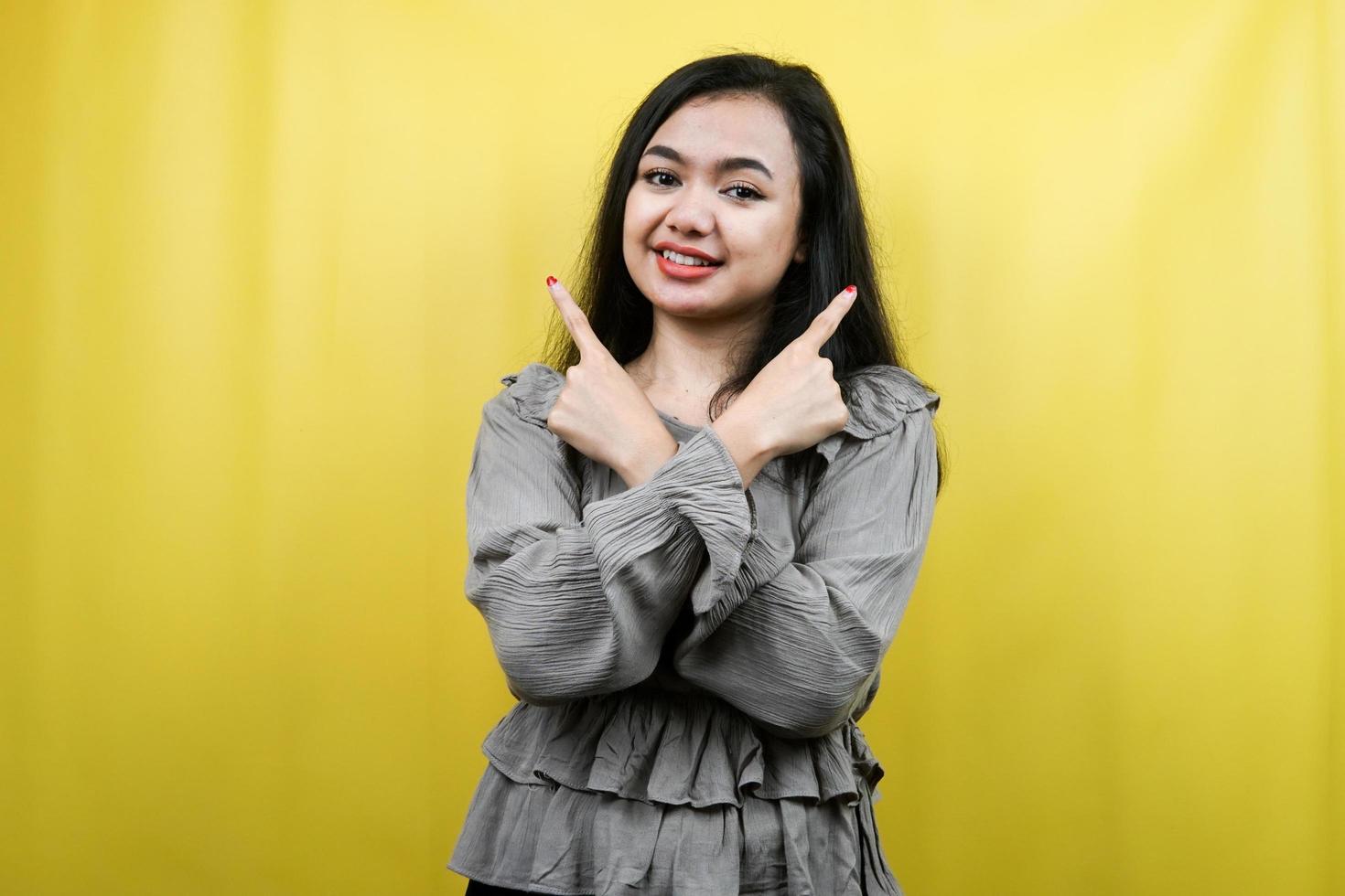 Beautiful young woman hands pointing at empty space presenting something, promoting products, advertising, isolated photo