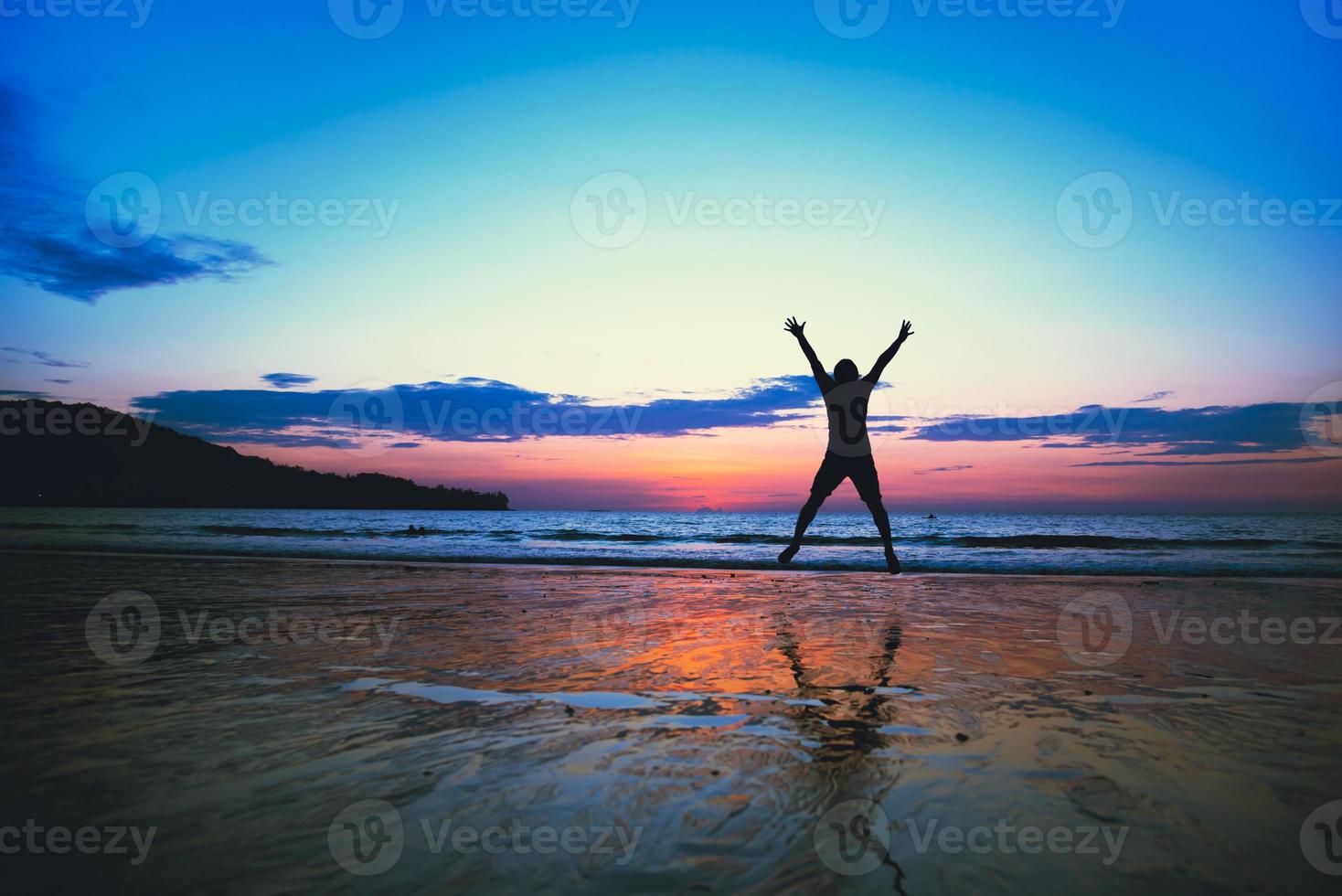 Asian man fun jumping and happy with beach tourism. summer photo