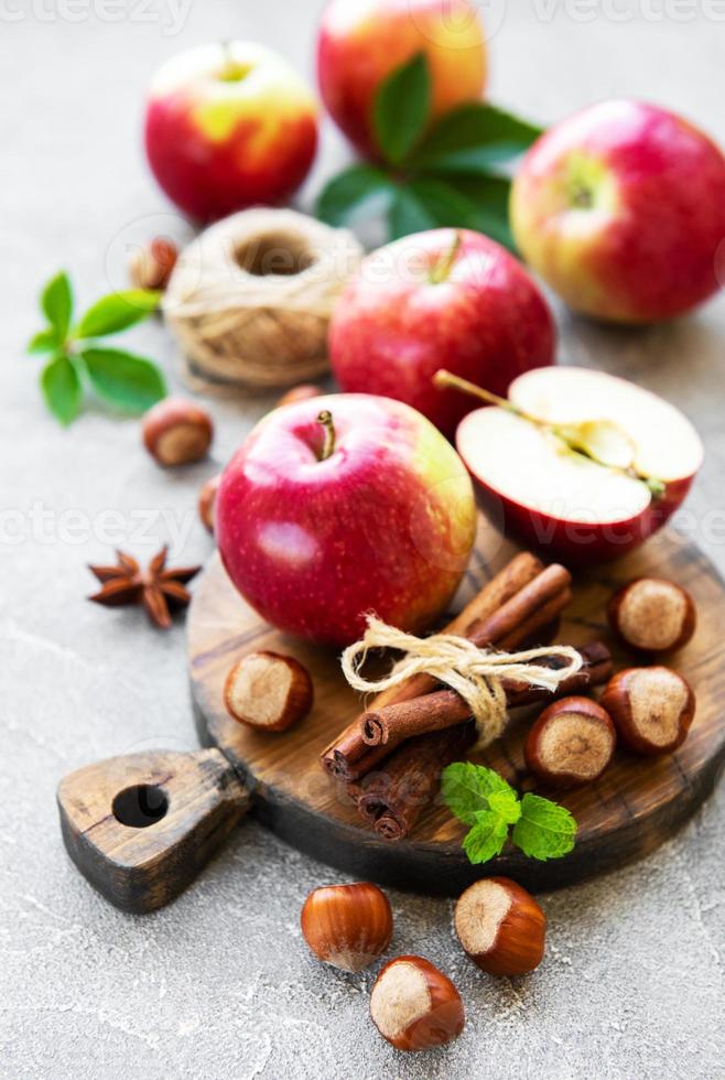 Fresh apples, hazelnuts and cinnamon photo