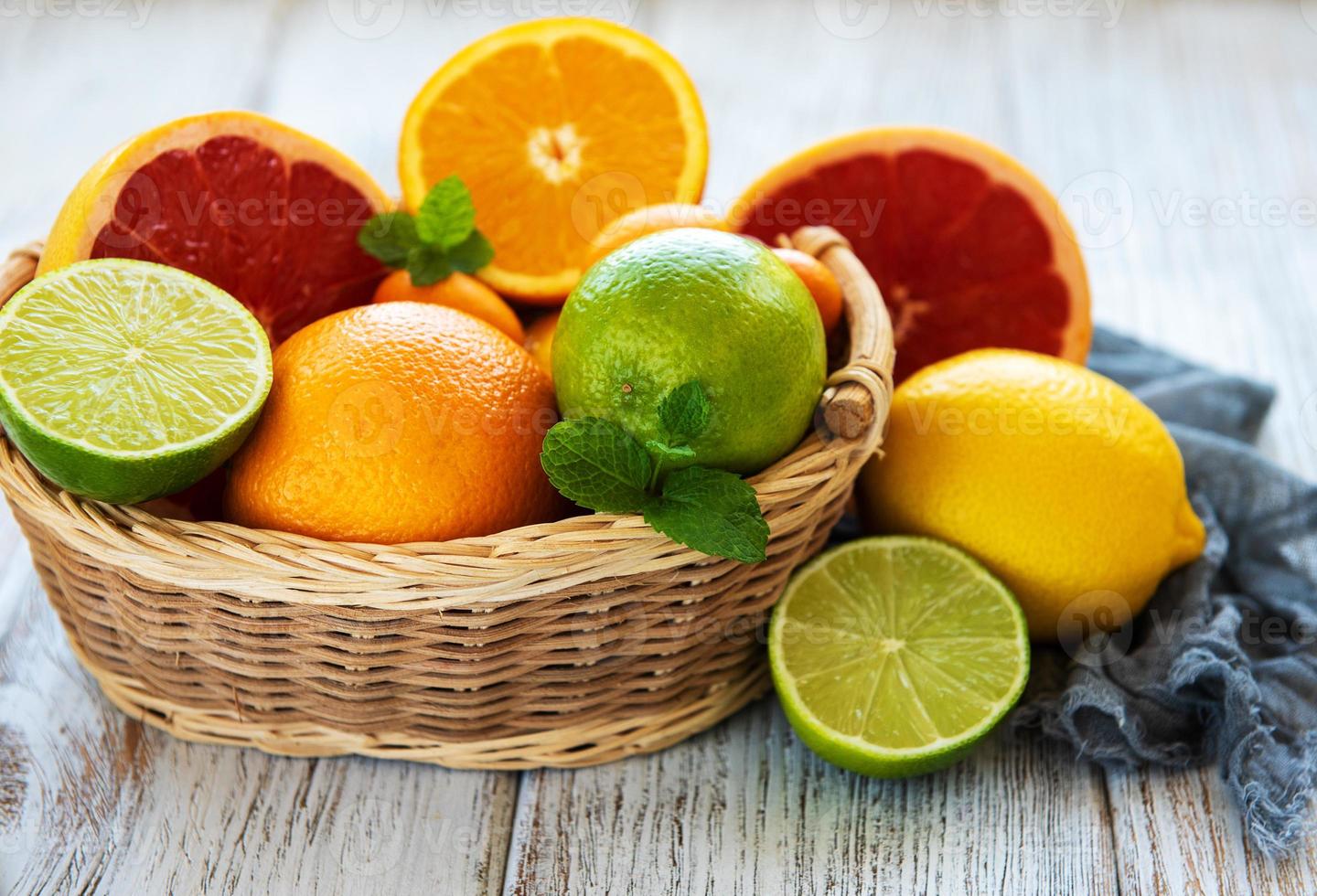 Basket with citrus fresh fruits photo