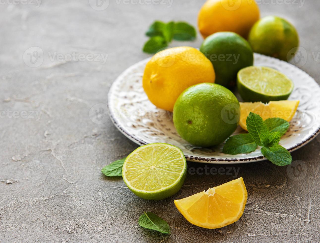 Plate with lemons and limes photo