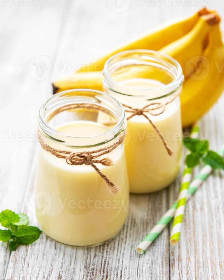 Banana yogurt and fresh bananas photo