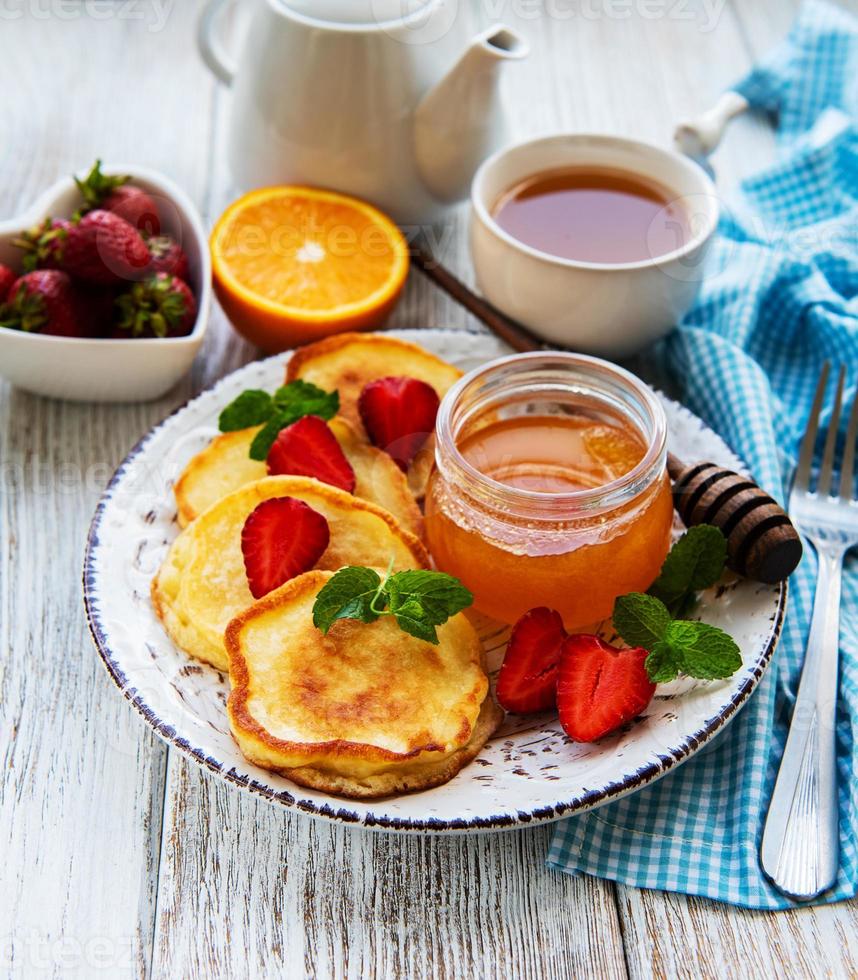Delicious pancakes with strawberry photo