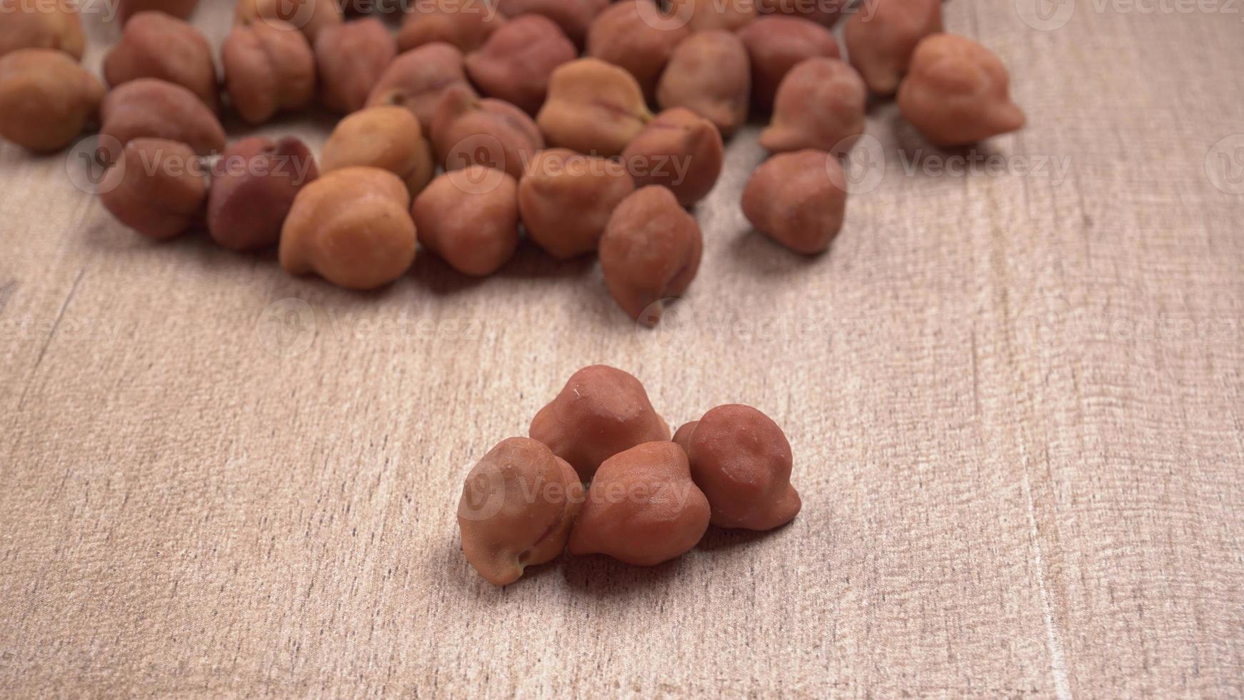Black Chickpeas or Kala Chana with chana dal pulse isolated on wooden Background. photo